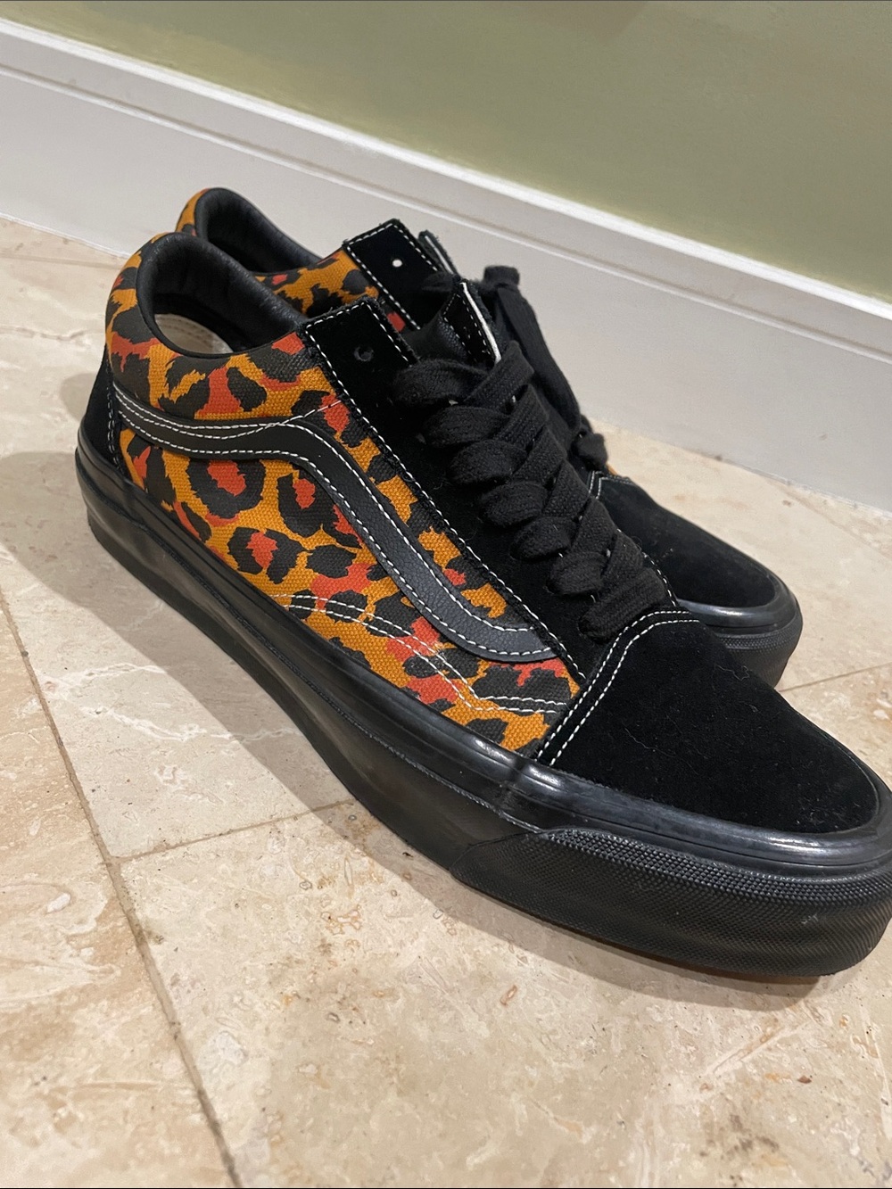 Vans Leopard Print Low Top Sneakers in Black & Orange